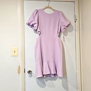 Lilac mini dress with flounce bottom and cutouts at waist. NWT